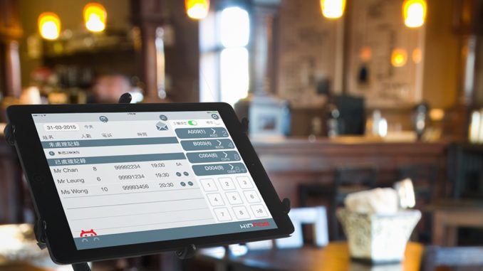 POS terminal in coffee cafe with software interface to take order and print receipt.