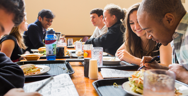 Group Of Students Eating Healthy Food Together.