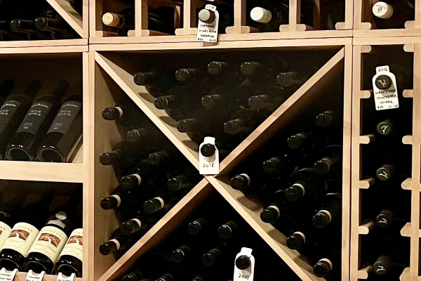 Number of wine bottles are arranged in the wine rack